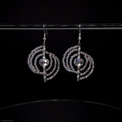 Sparkling silver spiral dangle earrings with clear crystal beads and faceted center stone. Handmade circle drop earrings with iridescent glass beads on fishhook wires for sensitive ears